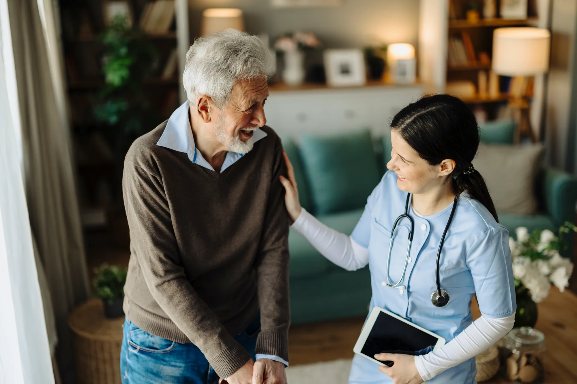 Nurse speaking with a senior patient